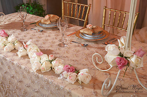 Sweetheart table with white,cream, and pink roses