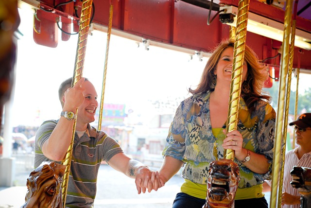 Lotus Blossom Photography Engagement Photo of Couple on Carousel