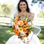 Enchanted Florist Bride with Orange Bouquet