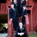 Enchanted Florist Southern Farm Wedding Photo of Groomsment Standing on Barn Steps