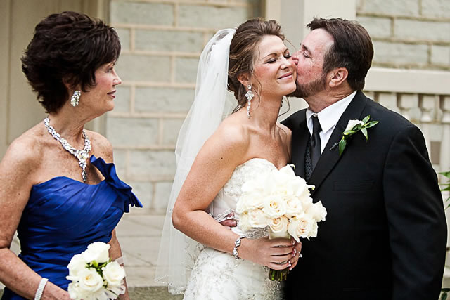 dads kiss at nashville wedding